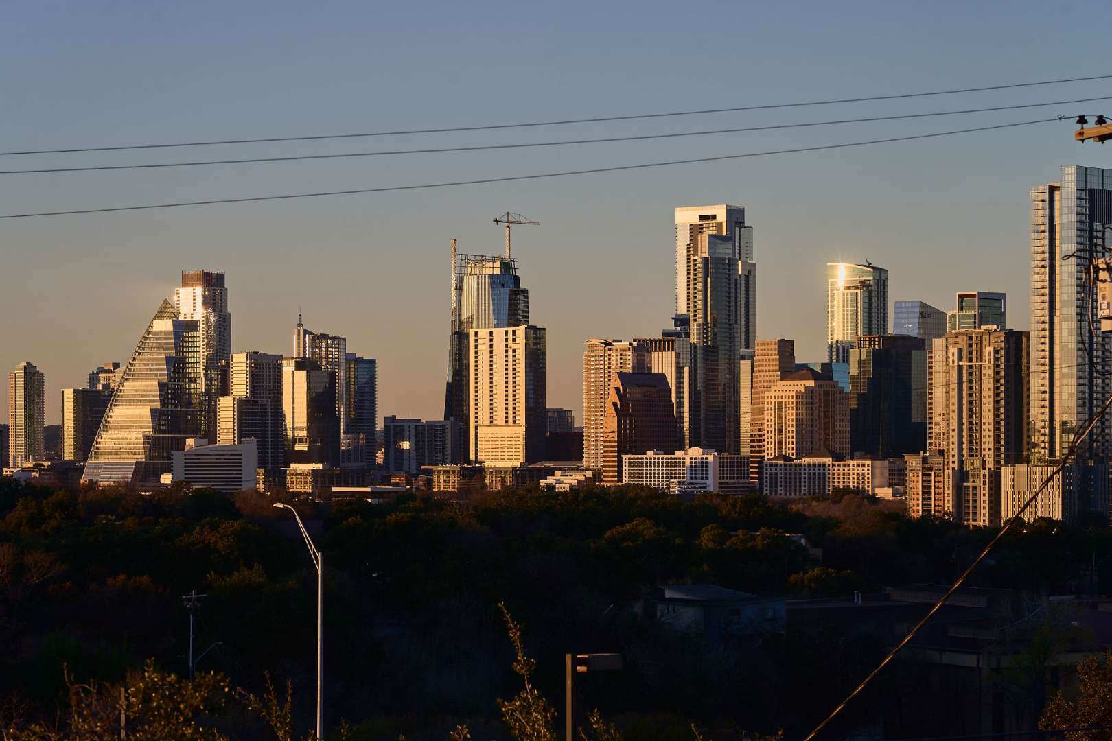 Golden hour view of the Austin skyline skyscrapers. Austin, TX | CKN Homes