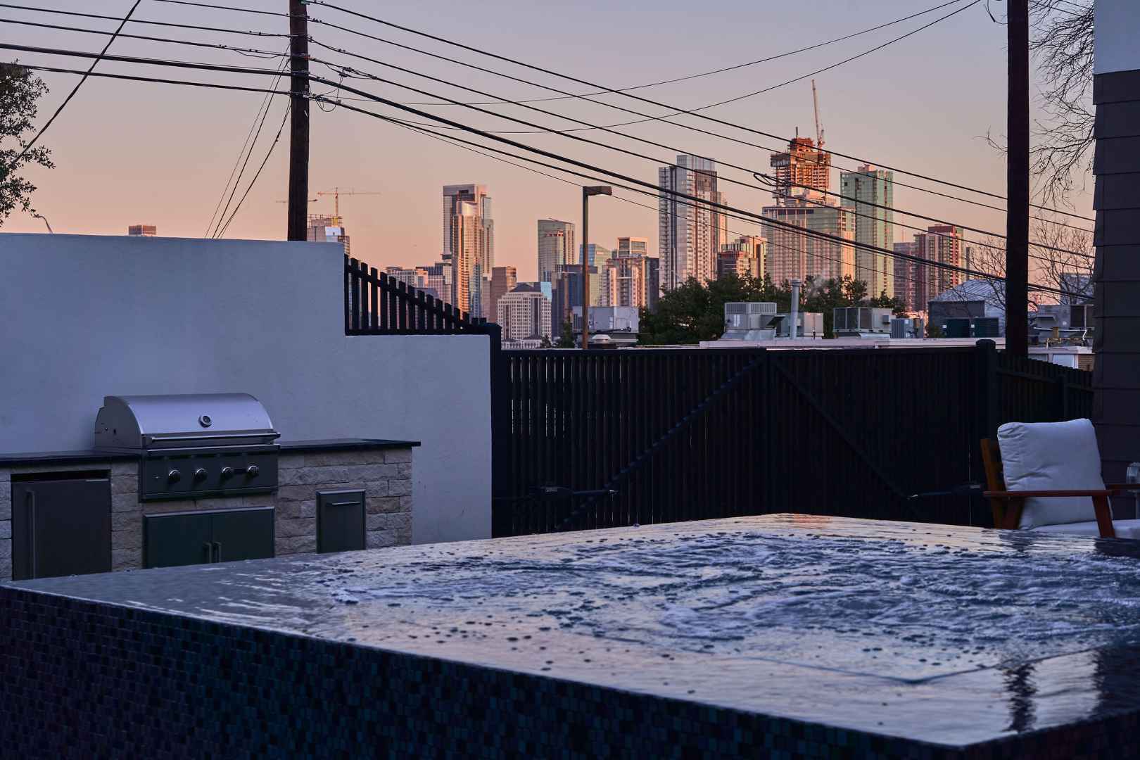 Rooftop spa with city views and outdoor seating. Austin, TX | CKN Homes