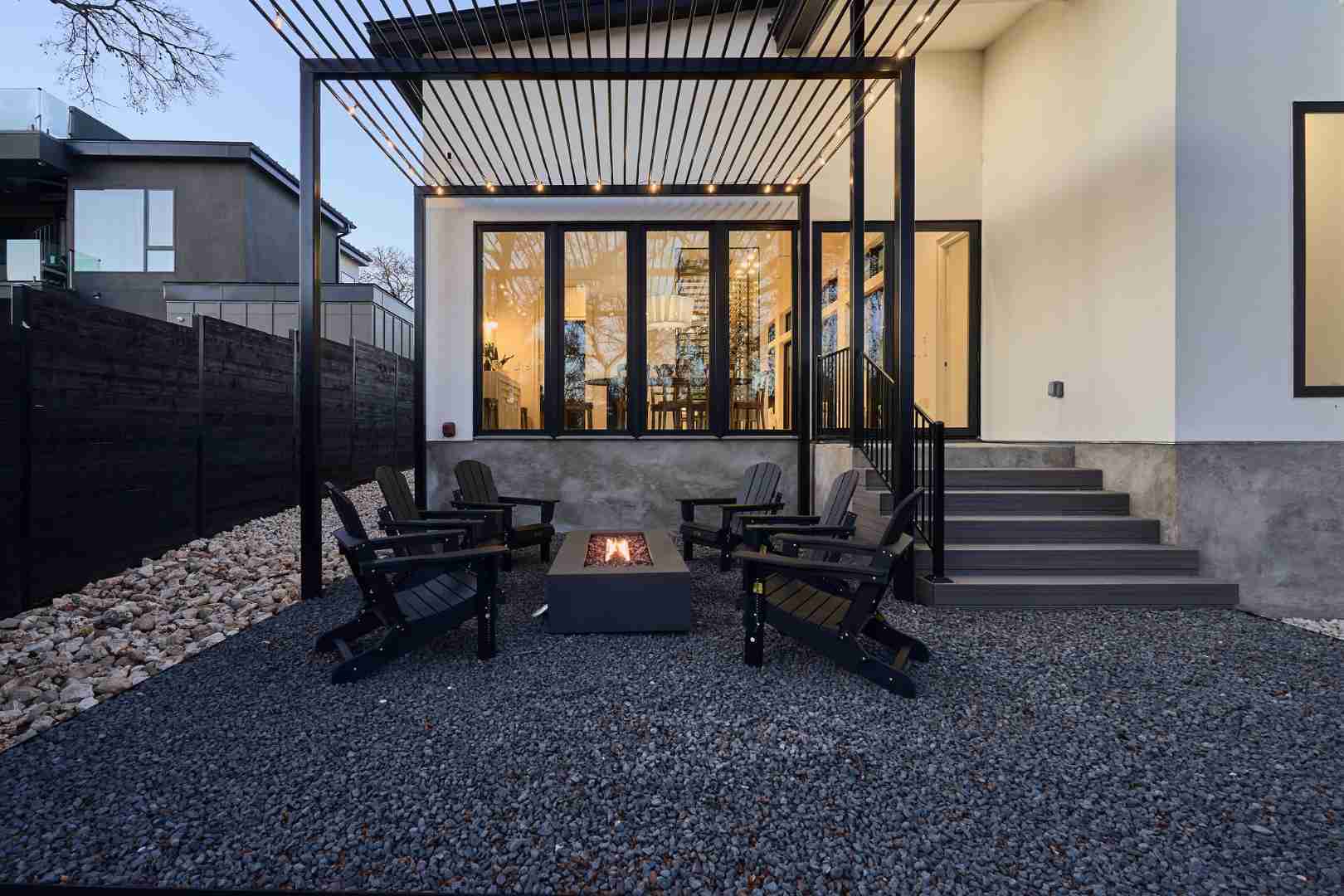 Cozy outdoor fire pit seating area. Austin, TX | CKN Homes