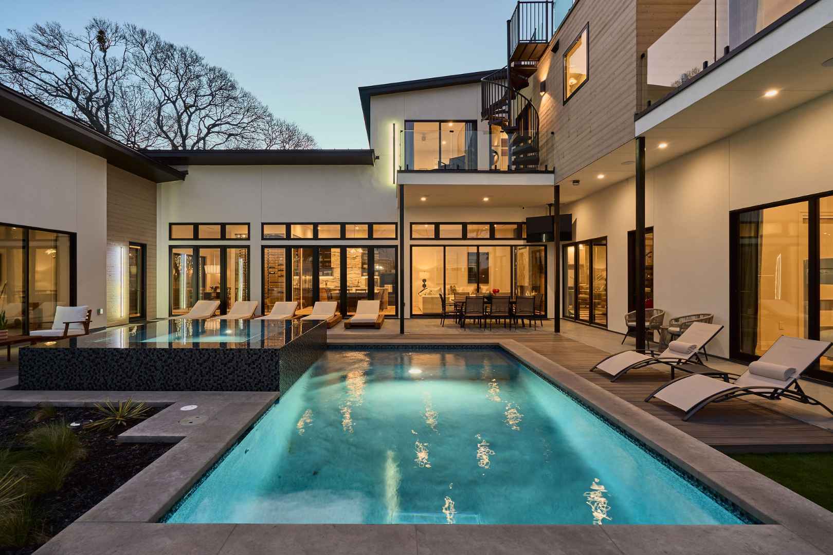 Modern luxury home featuring an elegant outdoor pool. Austin, TX | CKN Homes