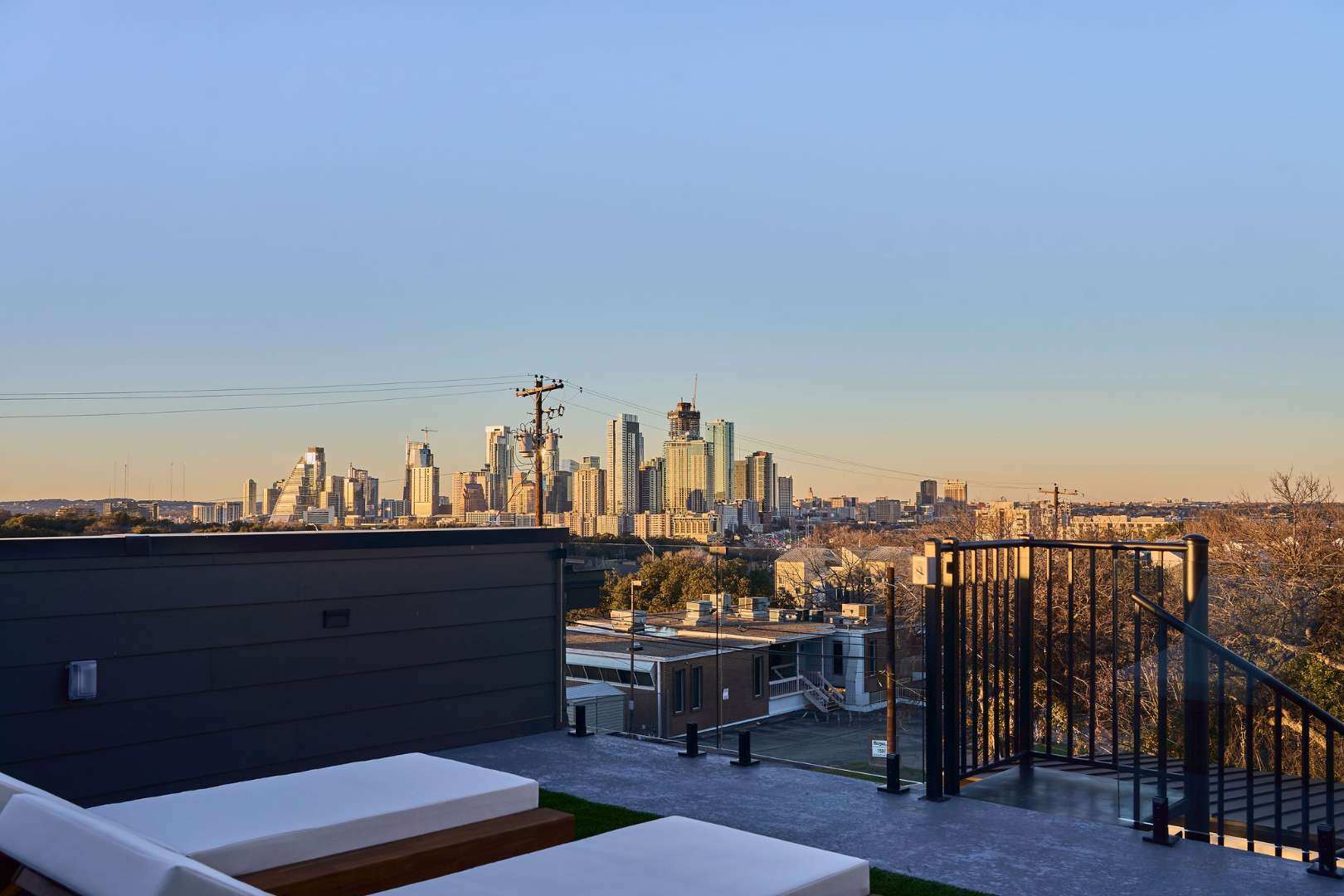 Rooftop lounge with Austin skyline view. Austin, TX | CKN Homes