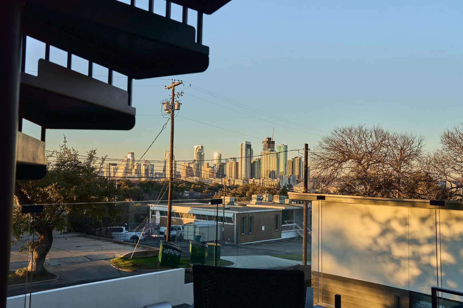 Spiral staircase leading to rooftop skyline view. Austin, TX | CKN Homes