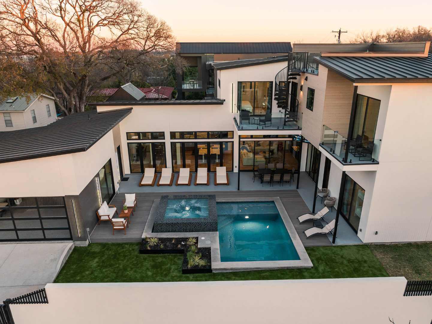 Sleek modern backyard with pool, lounge, and outdoor seating. Austin, TX | CKN Homes